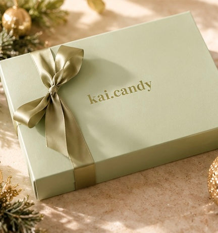 Unique 12 day Christmas advent calendar by Kai Candy, featuring handmade crystal candy in a luxury green gift box with individually wrapped festive sweets.