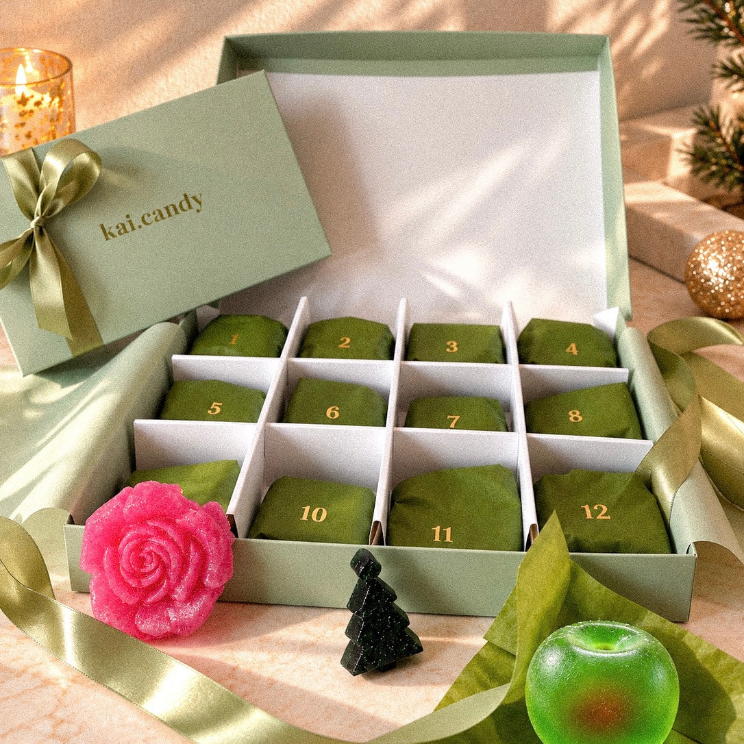 Unique 12 day Christmas advent calendar by Kai Candy, featuring handmade crystal candy in a luxury green gift box with individually wrapped festive sweets.