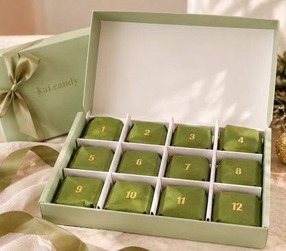 Unique 12 day Christmas advent calendar by Kai Candy, featuring handmade crystal candy in a luxury green gift box with individually wrapped festive sweets.